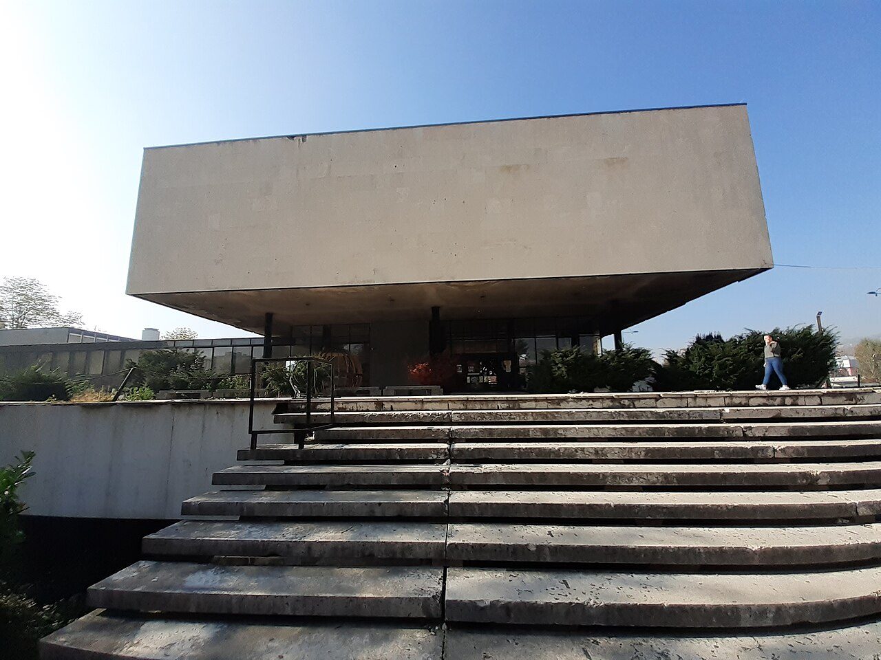 The modernist cube of the Historical Museum of Bosnia and Herzegovina, seen from the steps below