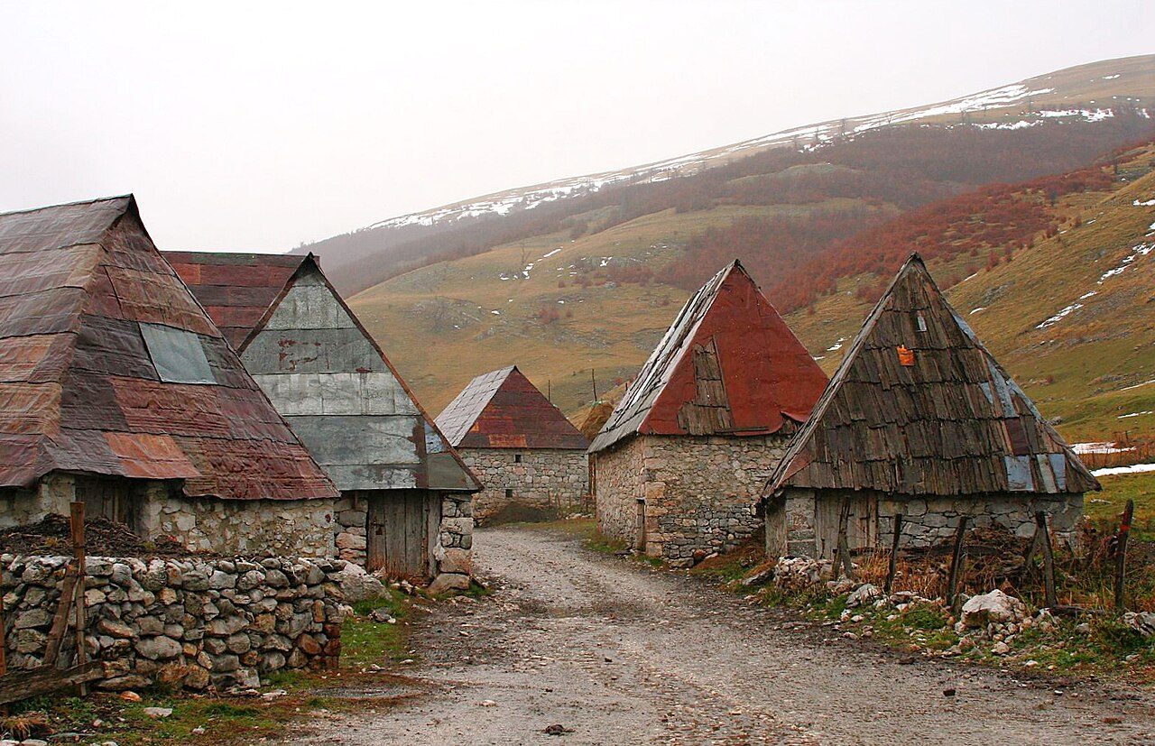 Lukomir's stone houses with steep wooden roofs, on the bare slopes of Bjelašnica