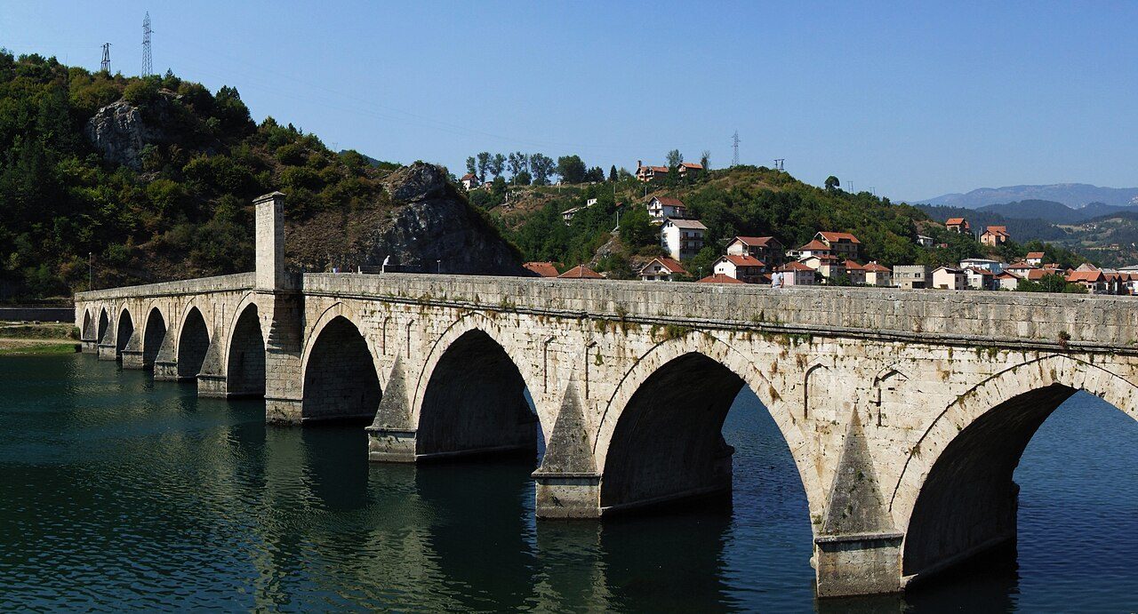 The long stone arches of the Mehmed Paša Sokolović Bridge over the Drina in Višegrad